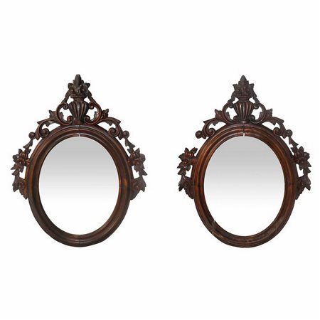 Coppia di specchiere ovali con intagli a motivi floreali applicati., fine 19° secolo