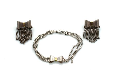 Demi-parure in argento con fiocchi