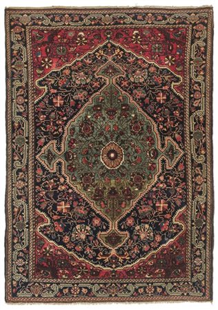 Tappeto Sarouk, Persia, fine secolo XIX. Decoro con medaglione con profili perl