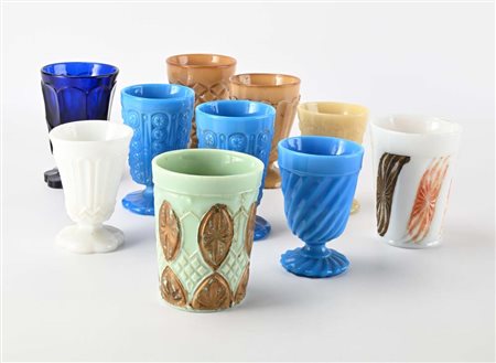 Nove bicchieri diversi in vetro molato di differenti colori e decorazione,...