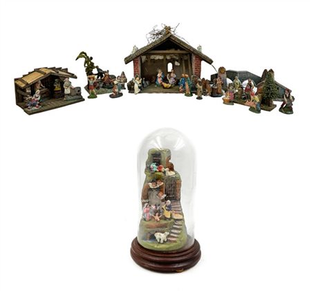 Cartone contenente numerosi pezzi da presepe e presepi in materiali vari (difet