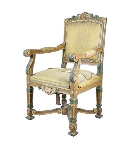 Poltrona in legno intagliato e dipinto in policromia con decoro a volute foglia