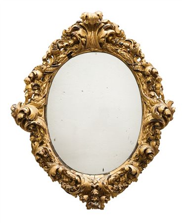 Specchiera con cornice barocca in legno intagliato e dorato di forma ovale deco