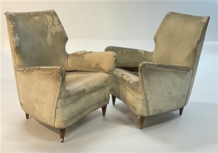 Coppia di poltrone. Italia, anni '50. Struttura in legno e rivestimento in pell