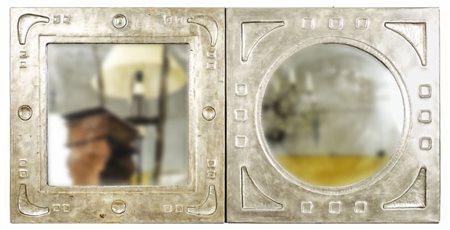 DUE SPECCHIERE RIVESTITE IN PELTRO - TWO PEWTER MIRRORS una ovale ed una...