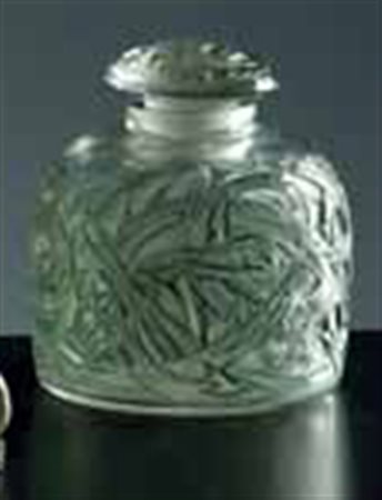 Lalique. Bottiglia con tappo in vetro “Epines” di forma cilindrica e decori...