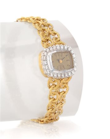OMEGAOMEGA LADY ANNI '70.Cassa ellittica in oro giallo 18 kt con lunetta in...