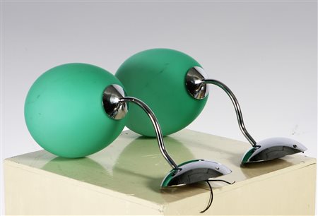 LEUCOS. Due appliques in vetro opalino verde. Two green opaline glass...
