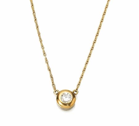 Collana 'punto luce' in oro giallo e diamante con brillante di ct. 0.40 circa...
