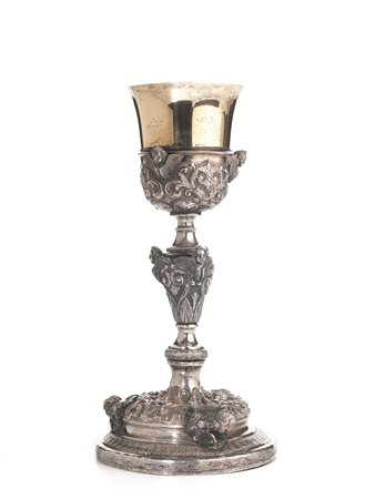 CALICE, SEC. XIXin argento, base gradinata e sbalzata a volute e teste di...