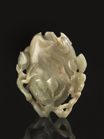 INTAGLIO, CINA, SEC. XXin giada verde celadon modellato nella forma di grande...