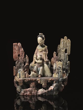 INTAGLIO, CINA, SEC. XIXin pietra saponaria raffigurante Guanyin con bambino...