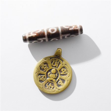 A Tibetan Tzi and a medal