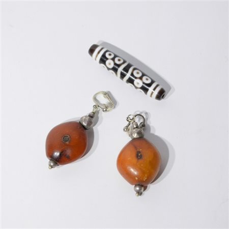A Tibetan Dzi and two earrings