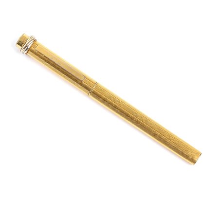 CARTIER Penna a sfera corpo e cappuccio placcati in oro; premendo la parte...