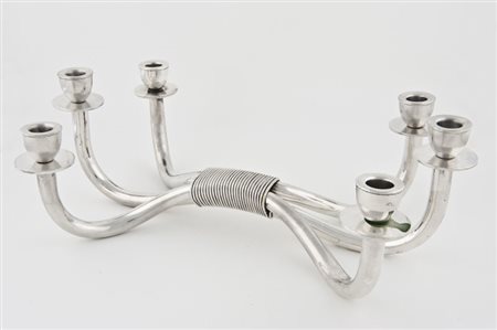 Candelabro a sei braccia in ottone placcato argento. Esecuzione italiana anni...