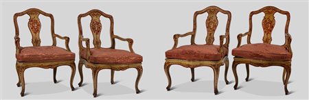 Quattro poltrone di forma mossa in legno laccato e dipinto a motivi floreali. Veneto, secolo XVIII