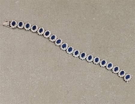 BRACCIALE BRACCIALE. In oro bianco 18 kt con settori a fiore centrati da...