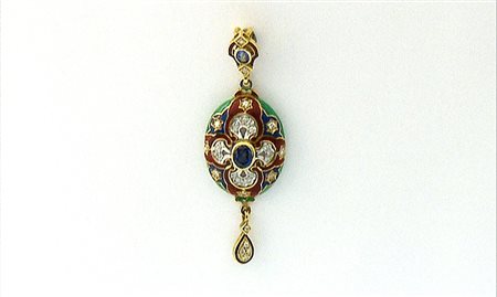 CIONDOLO CIONDOLO. In oro giallo e bianco 18 kt di forma ovalizzata con due...