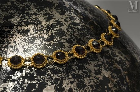 Collier en alliage d'or 14k (585 millièmes) formé de maillons en rosaces,...