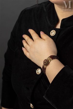 Bracelet en alliage d'or jaune 14k (585 millièmes) formé de 4 rangs de...