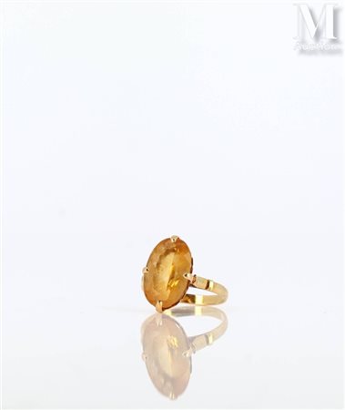 Bague Bague en or jaune 18k (750 millièmes) sertie d'une citrine ovale sur...