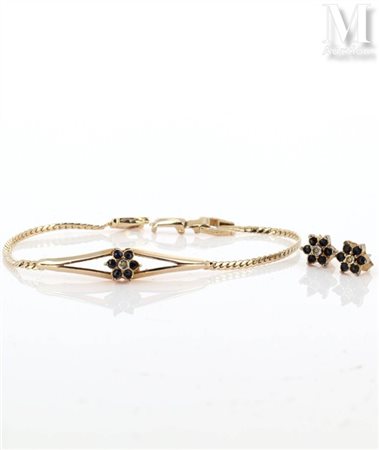 Demi-parure Demi parure en plaqué or comprenant un bracelet et une paire de...