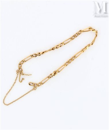 Gourmette Bracelet en or jaune 18K (750 millièmes) formé d'une maille...
