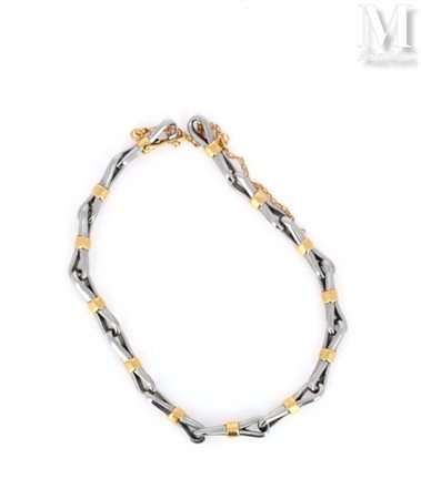 Bracelet Bracelet en métal argenté et or jaune 18k (750 millièmes) formé...