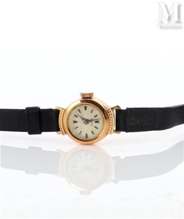 Montre de dame Montre de dame en or jaune 18k (750 millièmes). Cadran rond...
