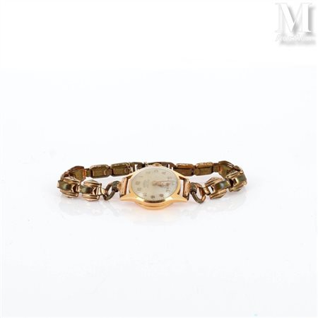 Montre Montre de dame en or jaune 18k (750 millièmes), cadran fond champagne...