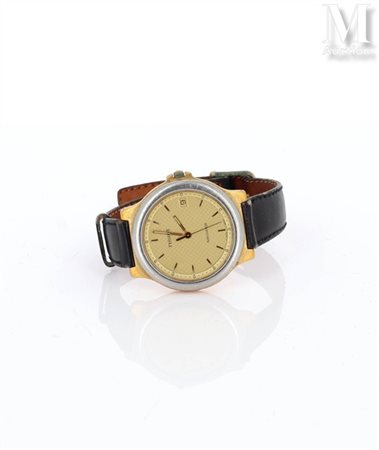 TISSOT Montre modèle Navigator en acier et métal doré. Cadran fond champagne...