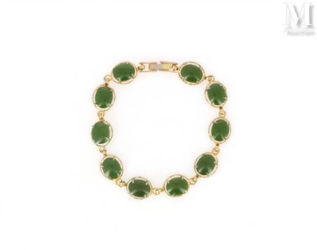 Bracelet Bracelet en métal doré formé de médaillons ovales sertis de...