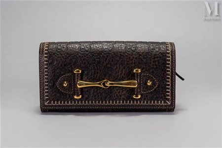 GUCCI Horsebit Portefeuille monogrammé "Horsebit" en cuir marron chocolat...