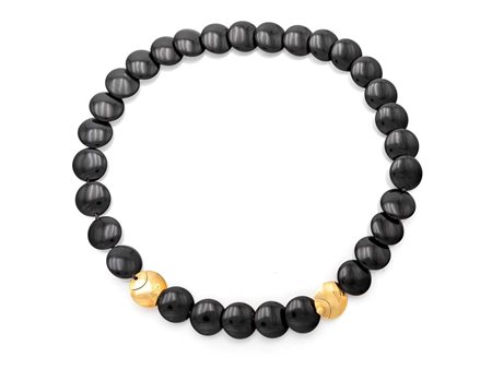 Tiffany, collana in oro e onici Lunghezza cm 50. Diametro elementi mm. 18 Oro...