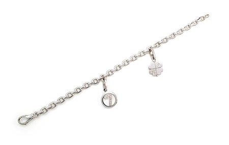 Cartier, bracciale con charms in oro e brillanti Lunghezza cm 18 Oro bianco...