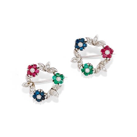 Coppia di spille con pietre di colore