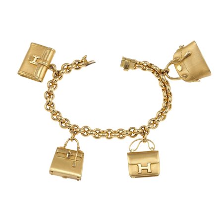 Hermès. Bracciale con charms oro giallo 750/1000. Astuccio originale, 87,9...