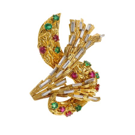 Cartier, Paris. Clip con diamanti, smeraldi e rubini montatura in oro giallo...