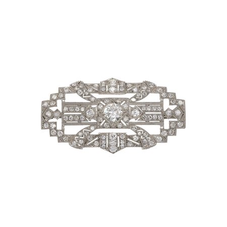 Spilla con diamanti montatura in oro bianco 750/1000. Un diamante mancante,...