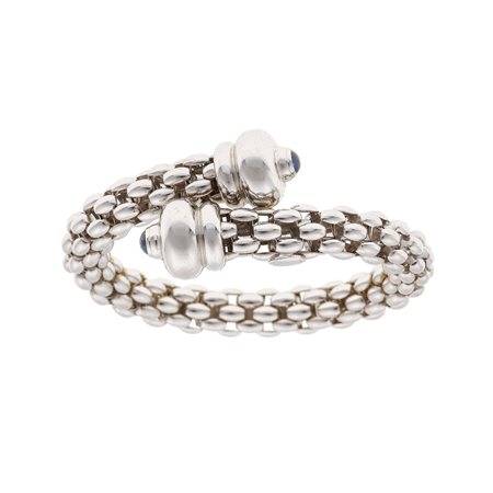 Fope. Bracciale rigido con due piccoli zaffiri taglio cabochon montatura in...