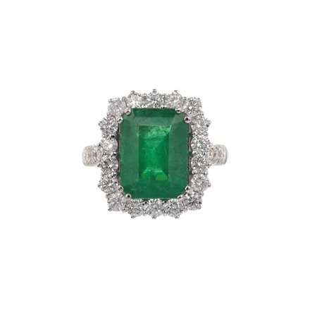 Anello con smeraldo Brasile di ct 4.52 e diamanti a contorno montatura in oro...