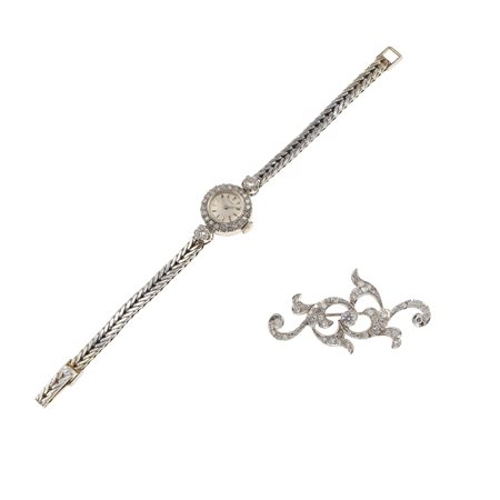 Lotto composto da un orologio da polso 'Movado' per signora e una spilla con...