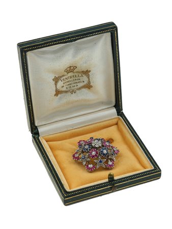 Spilla en tremblant con rubini, zaffiri e diamanti montatura in oro bianco...