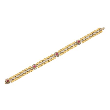 Bracciale con piccoli rubini cabochon e piccoli diamanti montatura in oro...