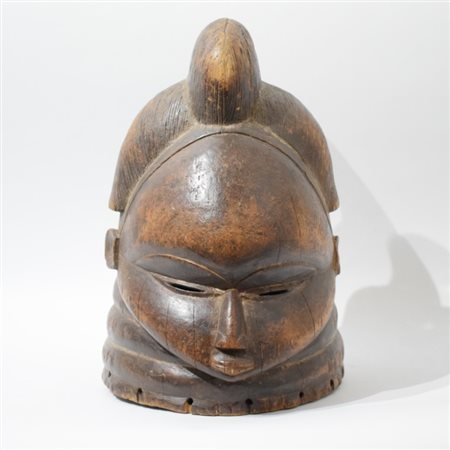 A large African Sowei helmet mask