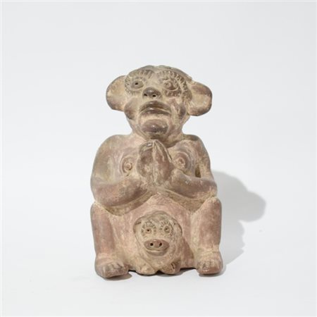 A terracotta female figure