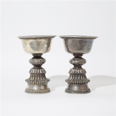 Two silver butter lamps