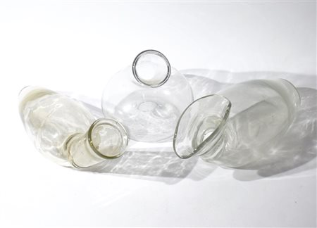 Three ancient glass urinal bottles