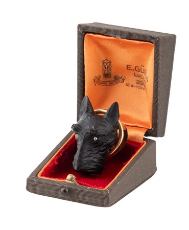 Gübelin, Spilla da rever in oro ed ebano con testa di Schnauzer. Lucerne, Zürich, 1925-1940 ca.